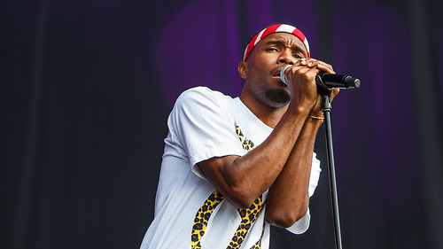 a picture of frank ocean singing on stage