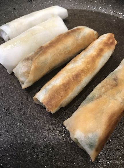 searing and frying the spring rolls