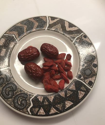 combing the Chinese dates and wolfberries into a cup