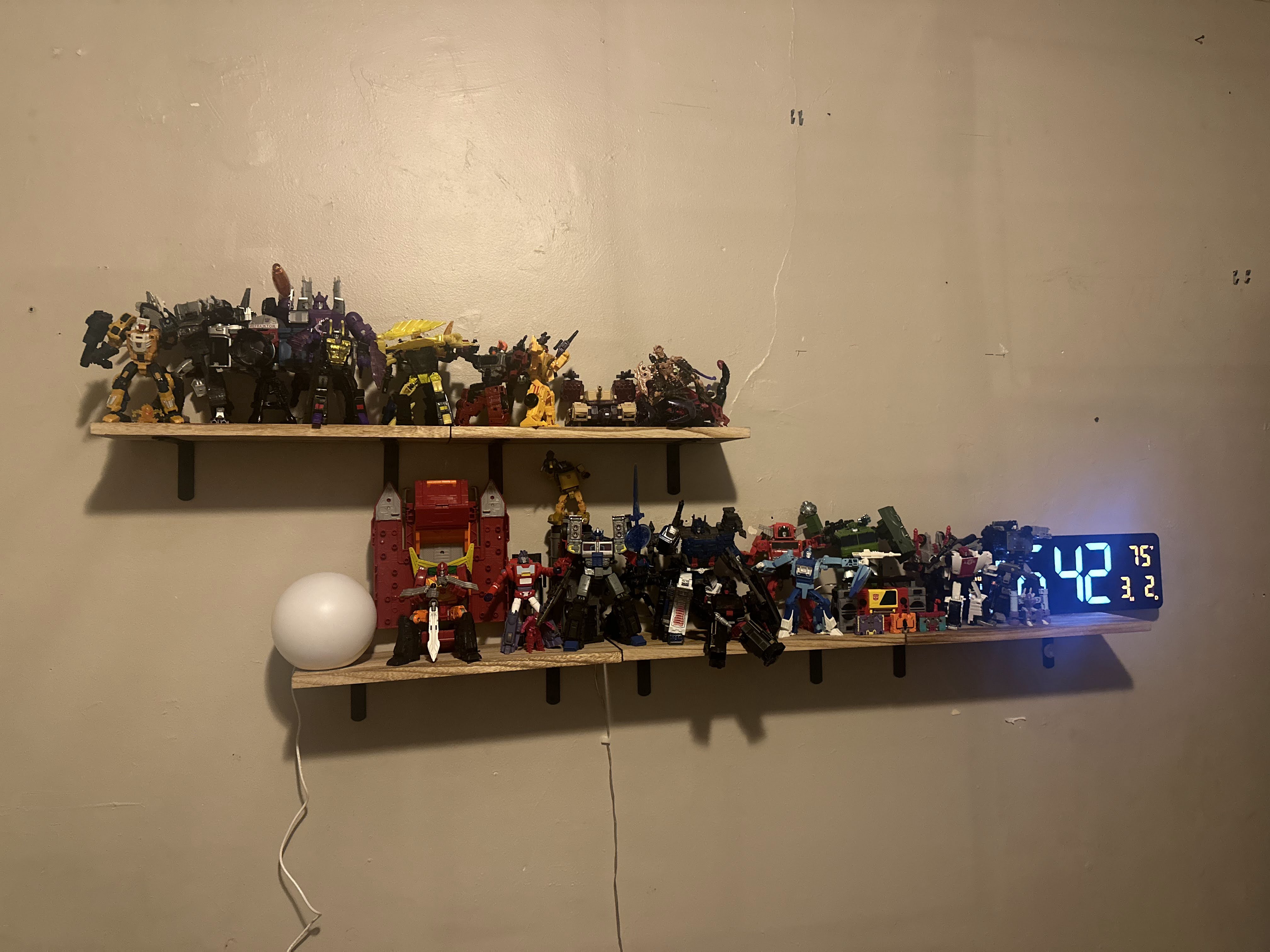 Shelf full of transformers figures