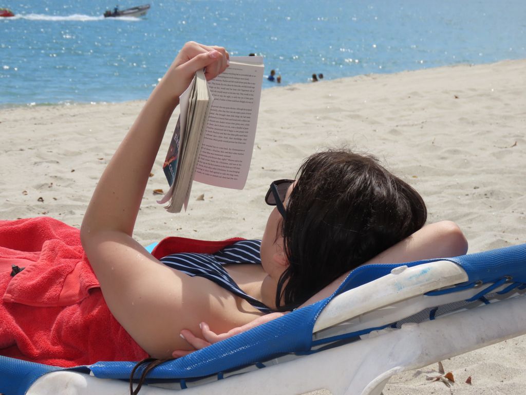 Woman reading on the beach