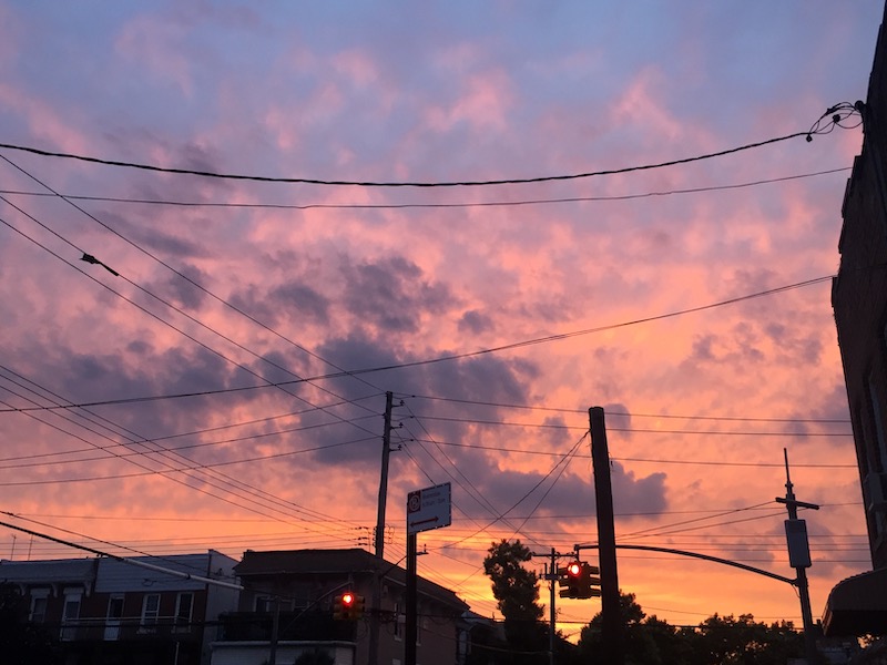 Purple/Orange Sunset in Brooklyn with houses and utility poles