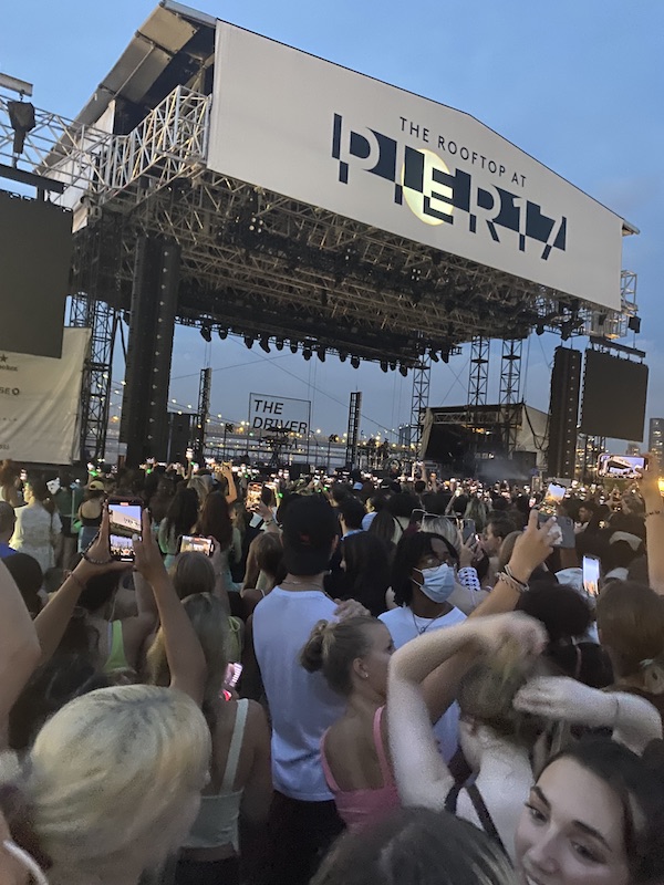 Image of a crowd of people in front of the Pier 17 concert stage