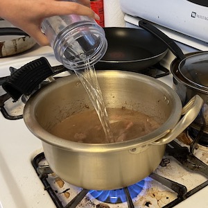 photo of adding water to the meat